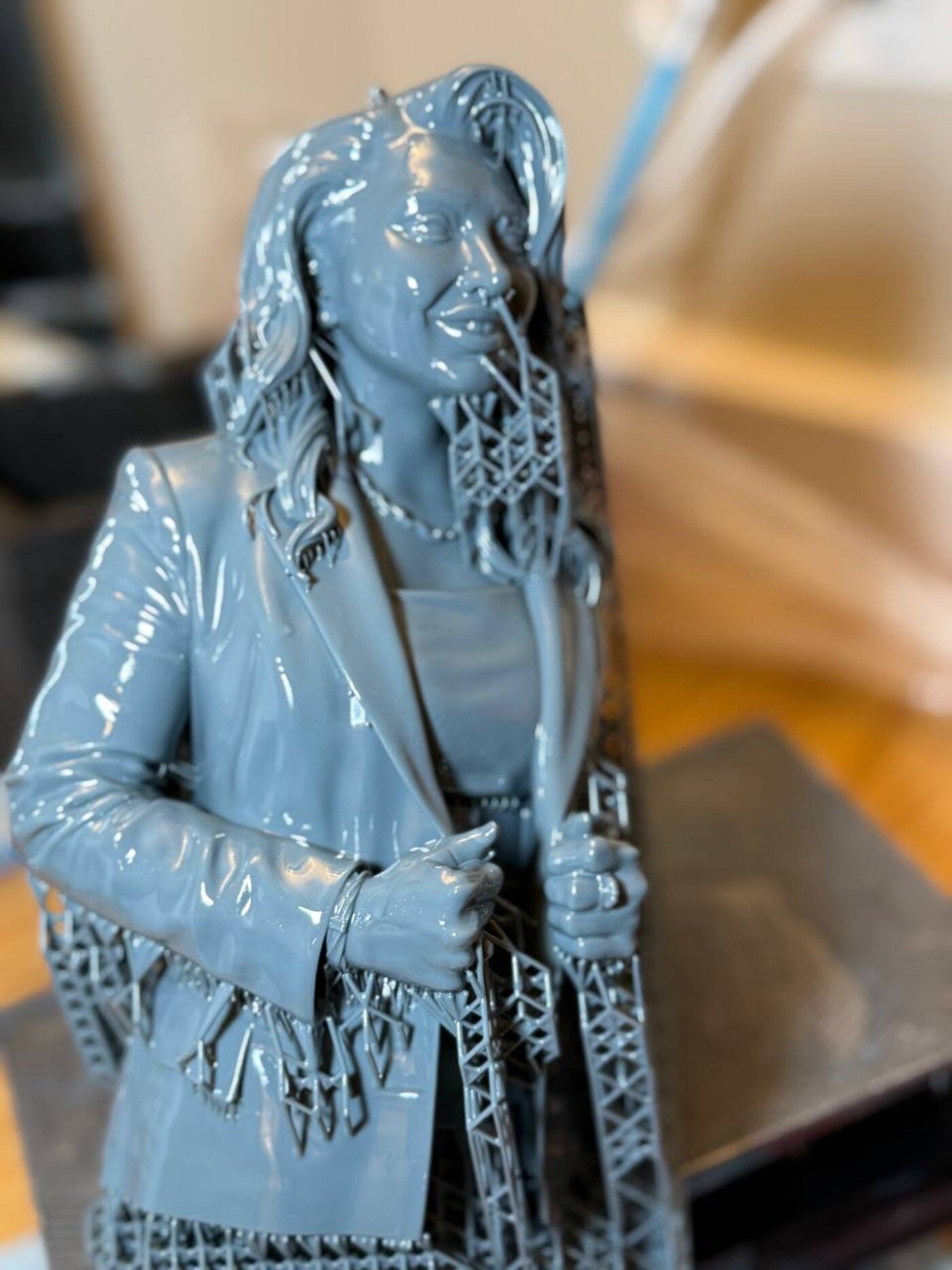 Freshly printed resin bust with production supports before finishing